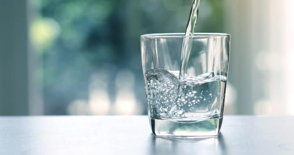 pouring purified fresh drink water